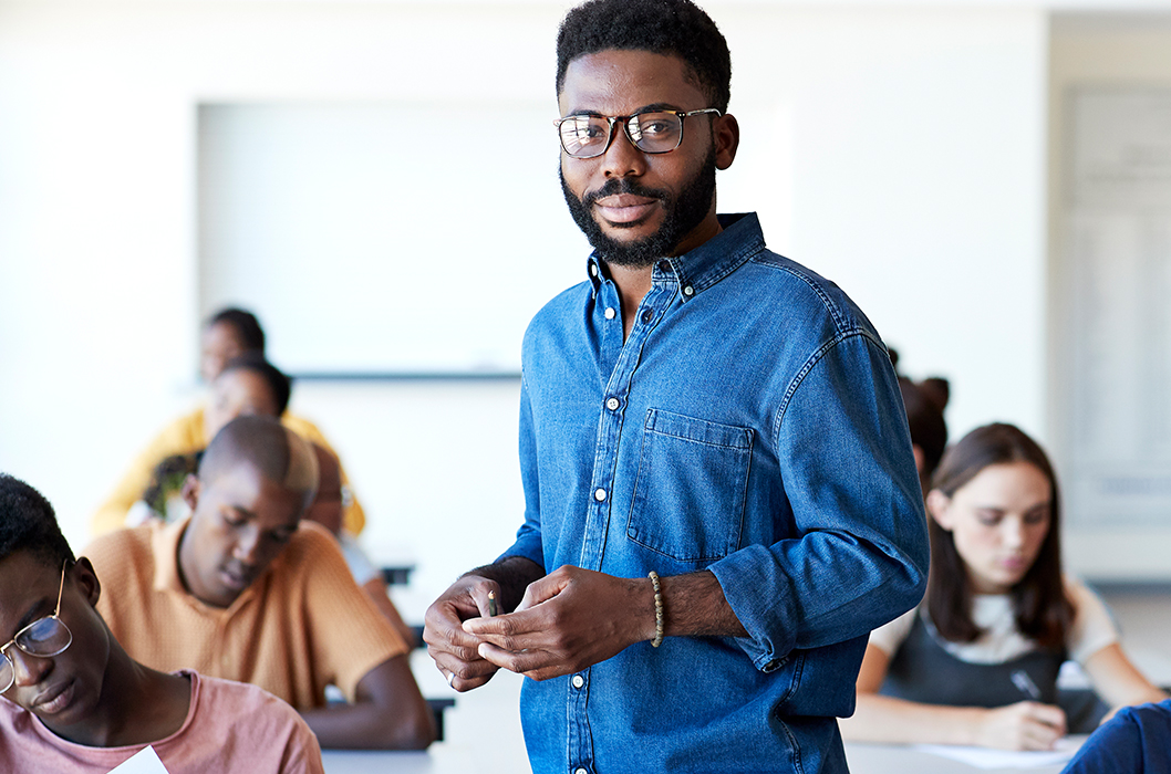 blue shirt man with specs